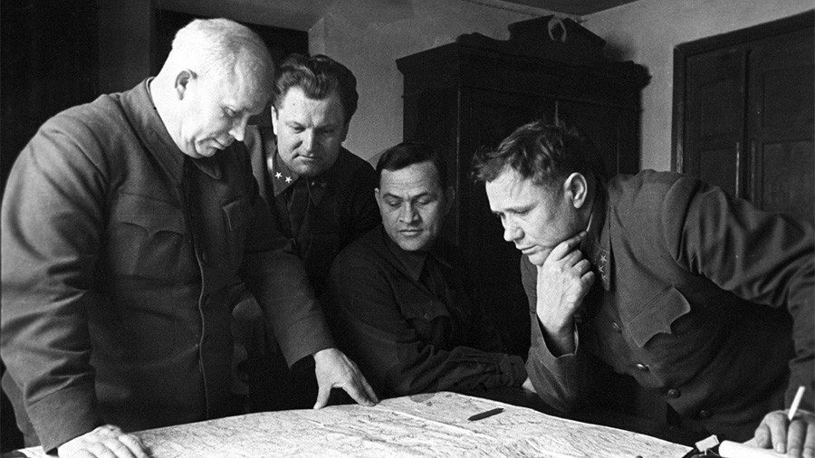 Soviet leaders reviewing a map of Stalingrad