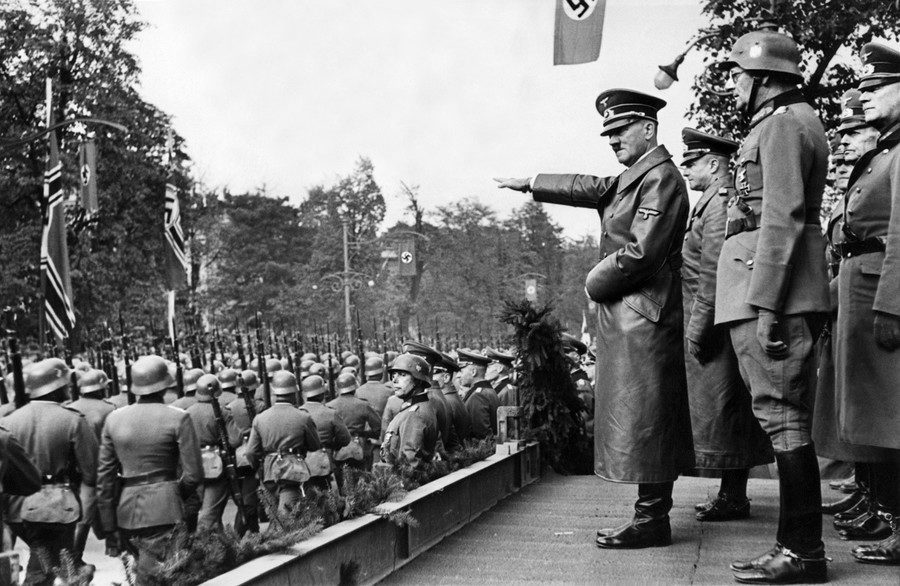 Hitler oversees a victory parade in Warsaw
