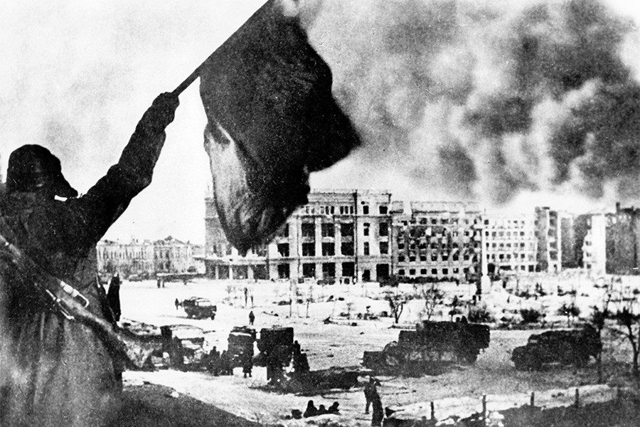 Click to enlarge A soldier of the Red Army waves the red flag