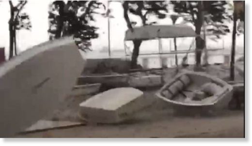 Three boats were seen being swept away by the wind in a video.