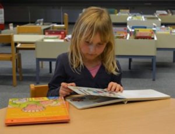 Click to enlarge child reading