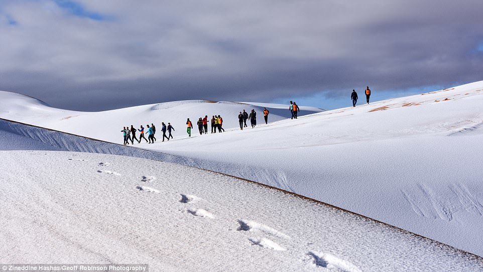 Click to enlarge Climb every mountain: The heavy snowfall makes the sand dunes look like snow-covered Alpine mountains