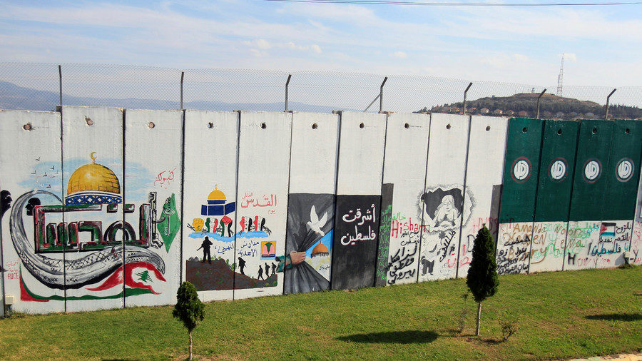 A wall decorated with graffiti is seen at Kfar Kila village near the Lebanese-Israeli border