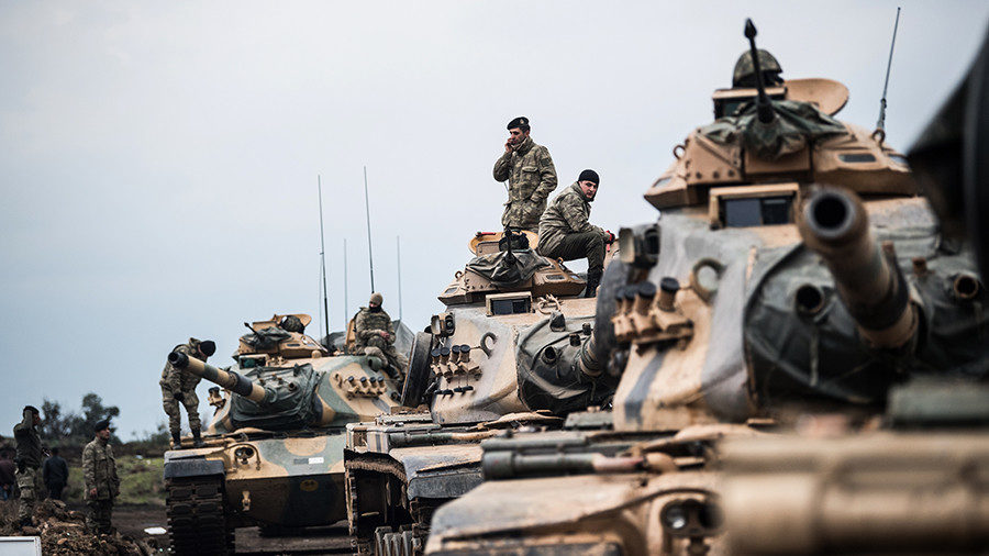 Turkish army tanks gather close to the Syrian border