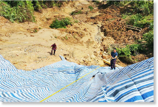 Canvasing an area to prevent further landslide.
