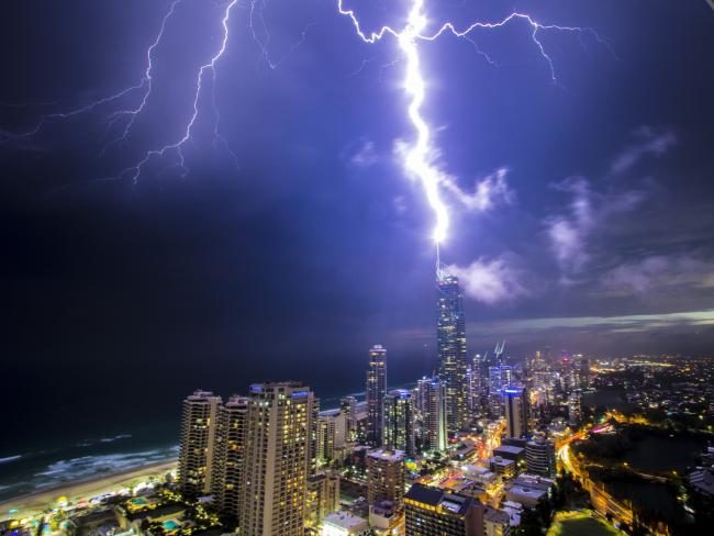 Click to enlarge Lightning strikes the Q1 tower on the Gold Coast during Sunday night's storm.