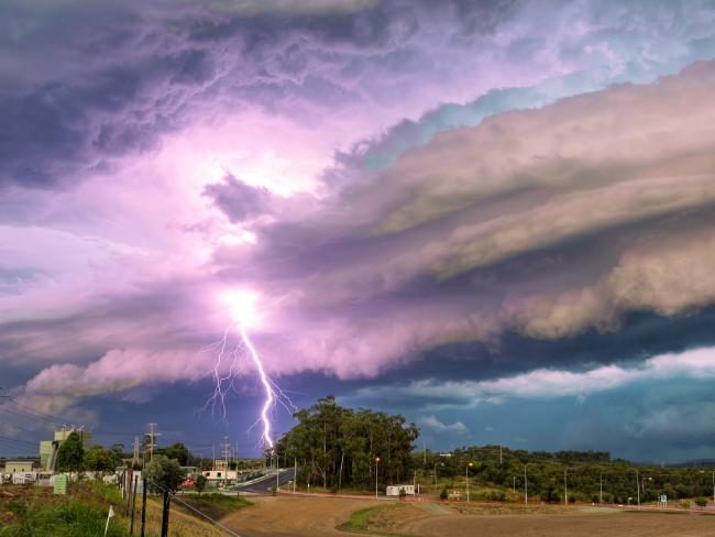 Click to enlarge A lightning strike and storm clouds at Redbank Plains.