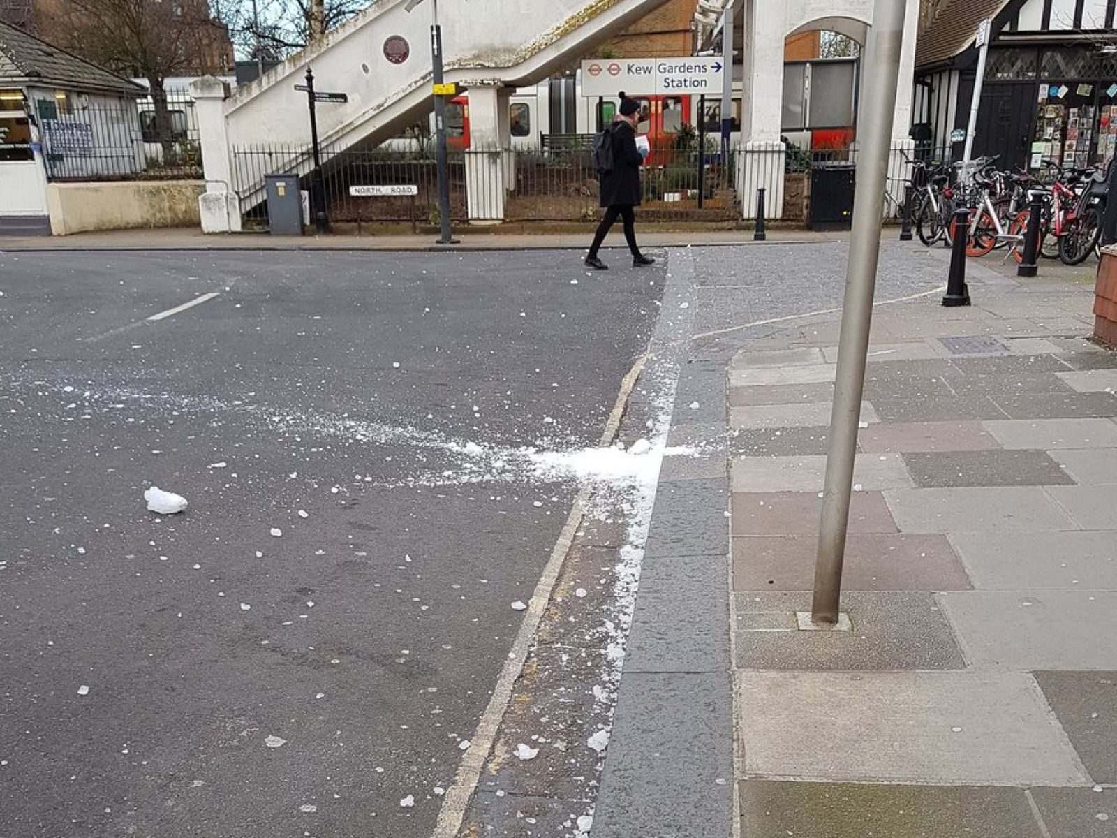 Click to enlarge Onlookers took photos of the smashed ice block
