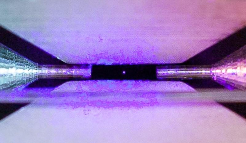 Click to enlarge a single, positively-charged strontium atom