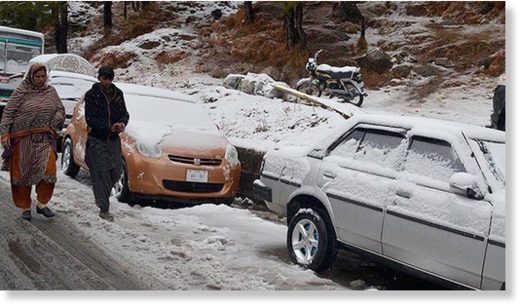 Vehicles covered in snow in Murree.