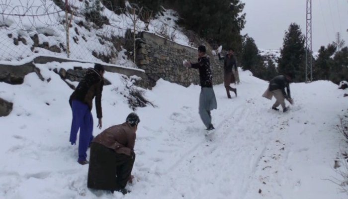 Click to enlarge People throw soft snowballs at each other.