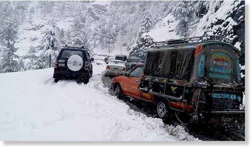 Vehicles stuck after snowfall in Shangla.