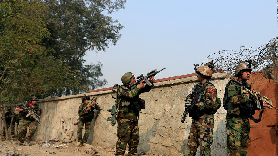 Afghan security forces take positions while responding to blasts and gunfire. January 24, 2018.