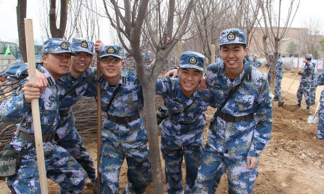PLA troops plant trees in central China.