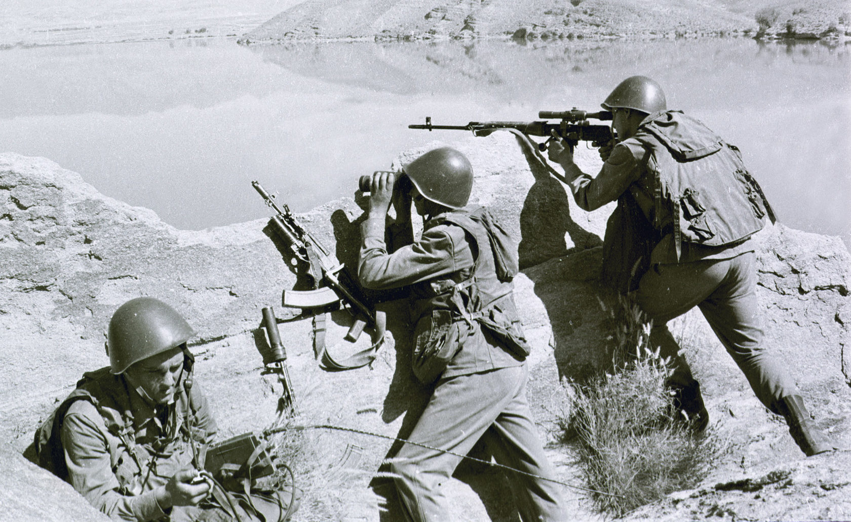 Soviet soldiers observe the highlands, while fighting Islamic guerrillas