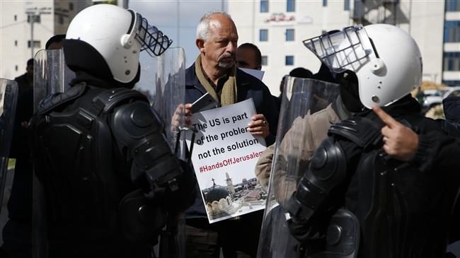 Click to enlarge Palestinian police control demonstrators