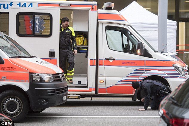 Click to enlarge Ambulances left the scene without their blue lights flashing and tents were quickly erected around the scene of the incident
