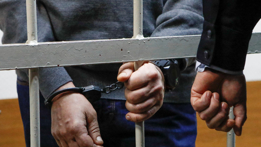 Click to enlarge prisoner behind bars
