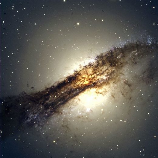 Centaurus A (NGC 5128) is an active galaxy that likely resulted from the recent merger of an elliptical with a spiral. Astronomers have now shown that 14 of 16 surveyed satellite galaxies rotate around the parent galaxy coherently in a plane.