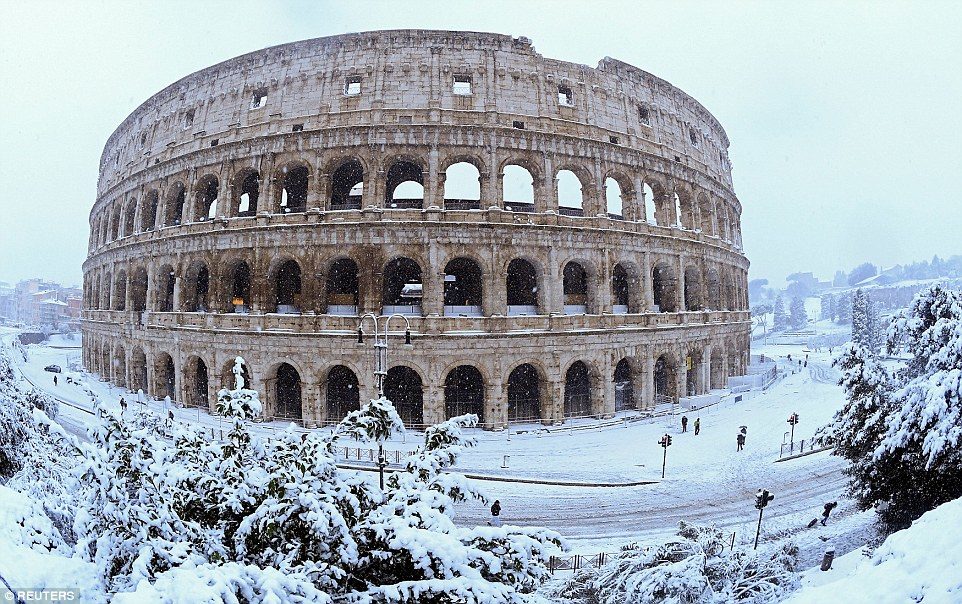 A rare snow storm in Rome on Monday disrupted transport, shut down schools and prompted authorities to call in the army to help clear the streets. Pictured, the Colosseum