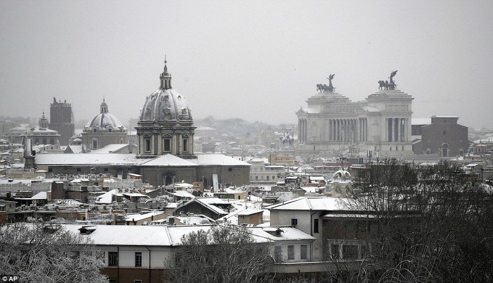 A view of Rome's snow-capped skyline, with the Monument of the Unknown Soldier seen at right, after snowfall on Monday