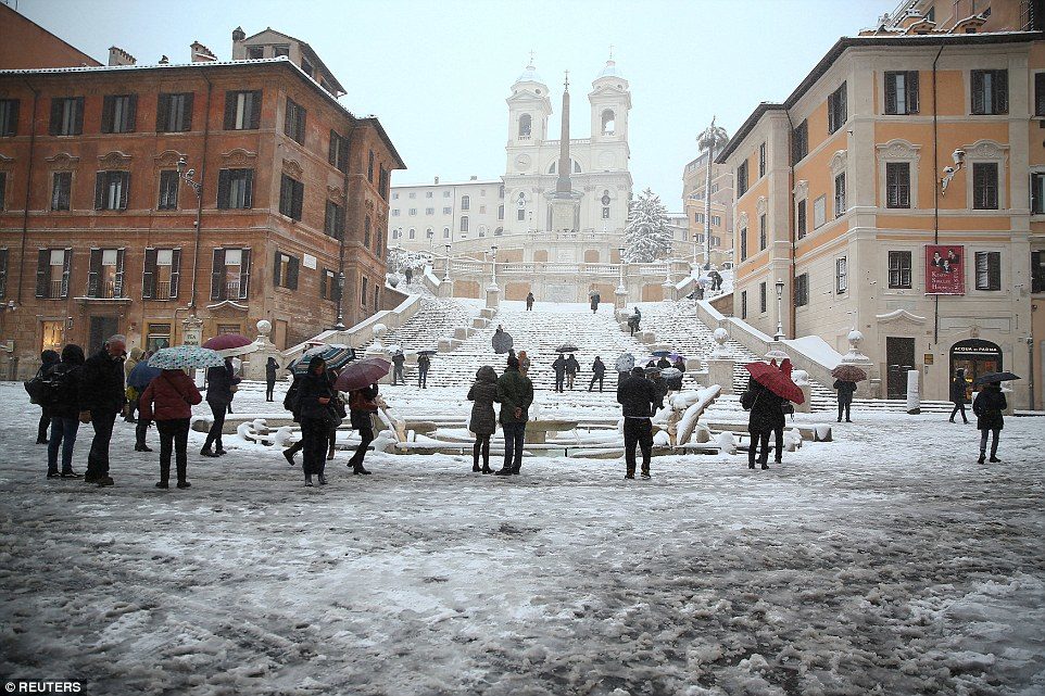The residents of Rome are seen in front of the Spanish Steps to enjoy the unusual weather in the Italian capital