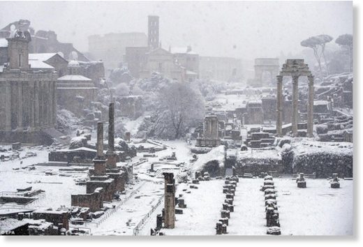 Click to enlarge The Fori Imperiali, once the centre of the Roman Empire, is seen covered by snow in Rome on Monday morning