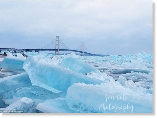 Click to enlarge Stunning photographs have capture the epic natural phenomenon known as blue ice forming on Michigan's upper and lower peninsulas