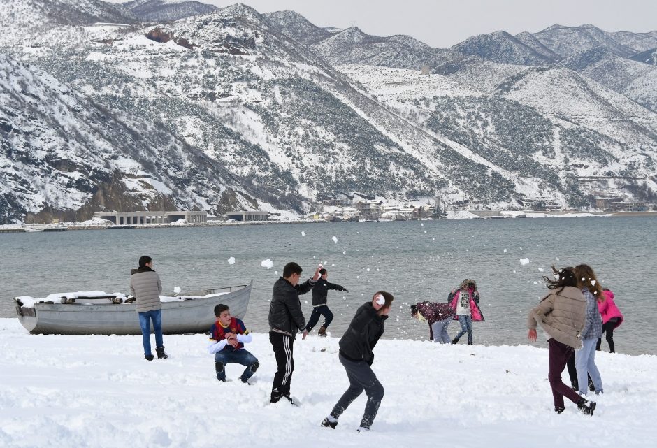 Click to enlarge Children played in the snow at a park in Pogradec, in southeast Albania, on Tuesday.