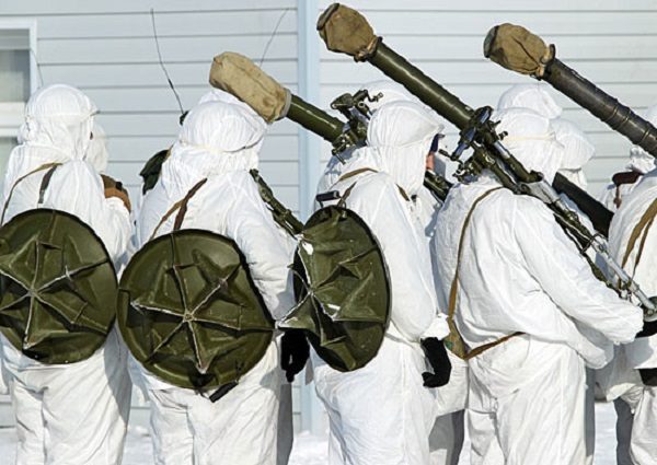Servicemen carrying disassembled 2B14 ‘Podnos’ mortars.