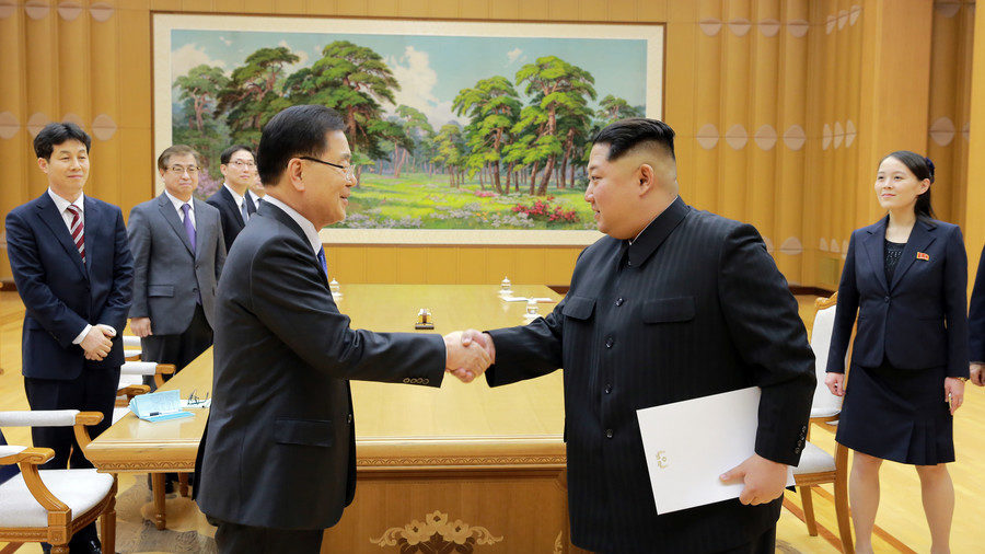 Click to enlarge North Korean leader Kim Jong Un greets Chung Eui-yong, head of the presidential National Security Office
