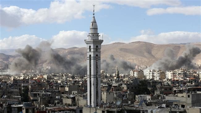 Click to enlarge Smoke rises from the Eastern Ghouta region
