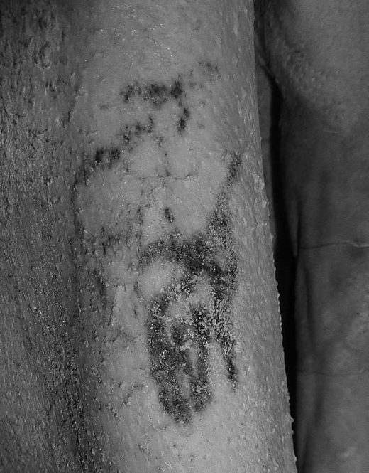 tattoo on his 5,000-year-old skin become visible.