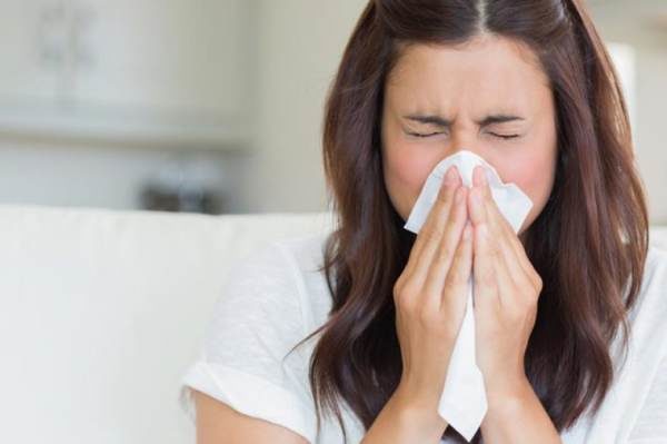 woman sneeze