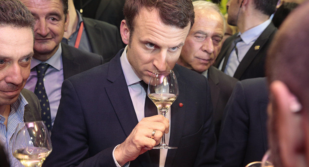 Macron wine drinking