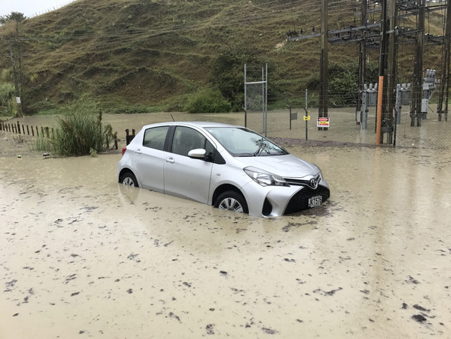 Click to enlarge Hawke's Bay Today photographer's car caught in flooding in Eskdale area, near Napier. He only left it for 15 minutes!