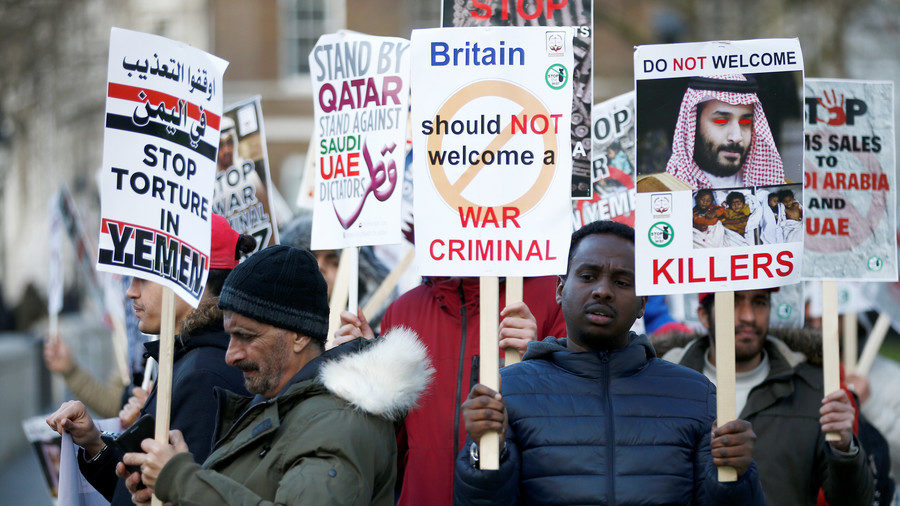 Click to enlarge Protesters wave placards opposite Downing Street