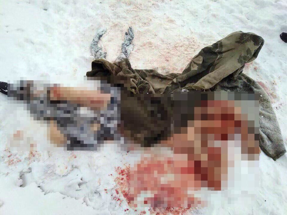 Mr Shushunov's mauled body lies at the scene of his horrific attack