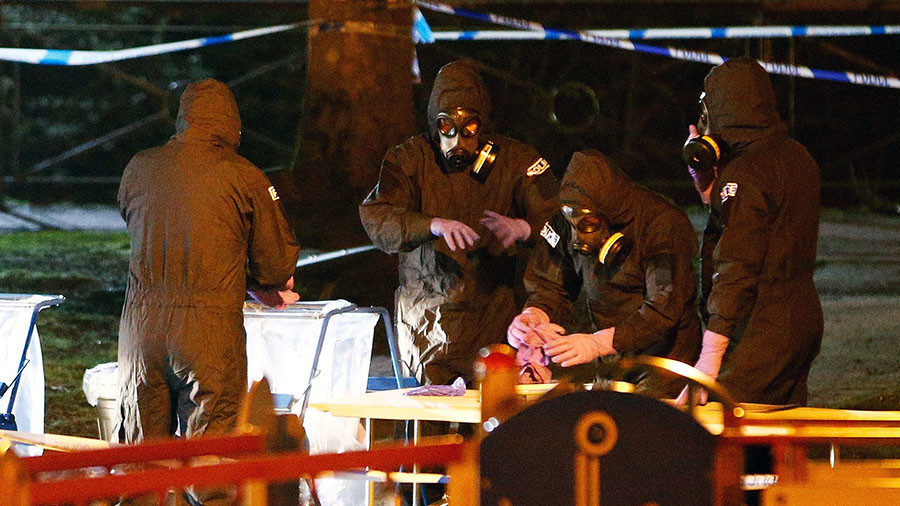 Click to enlarge Members of the emergency services wearing protective clothing work next to a children's play area near the bench where former Russian intelligence officer Sergei Skripal and his daughter Yulia were found poisoned in Salisbury, Britain, March 13, 2018.