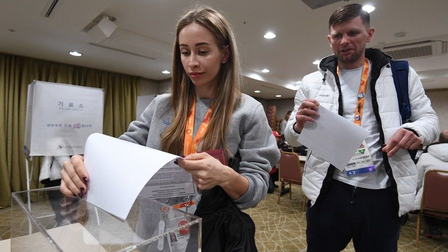 Russian athletes cast their votes at the early voting in Russian presidential elections 