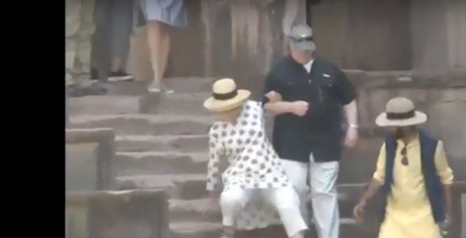 Hillary slipping on steps india