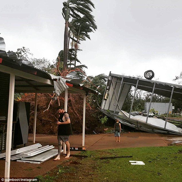 A tin roof was ripped off by the cyclone and even tipped one tin shed upside down