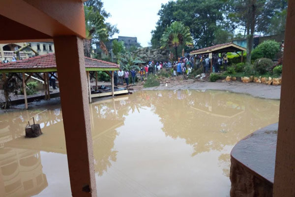 Click to enlarge Flooding water at Rwizi Arch Hotel in Kamukuzi Division, Mbarara District after heavy downpour on Wednesday.