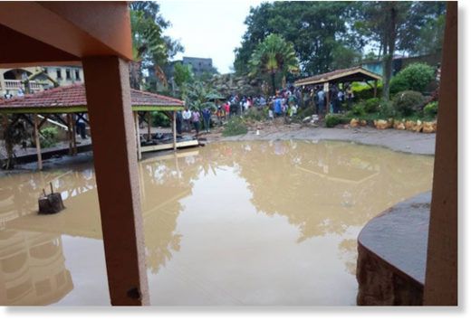 Click to enlarge Flooding water at Rwizi Arch Hotel in Kamukuzi Division, Mbarara District after heavy downpour on Wednesday.