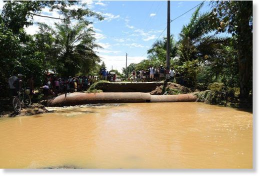 Click to enlarge A section of the road washed away by floods in Maroanstetra District in north-eastern Madagascar following the landing of tropical storm Eliakim on the island nation on March 17, 2018.