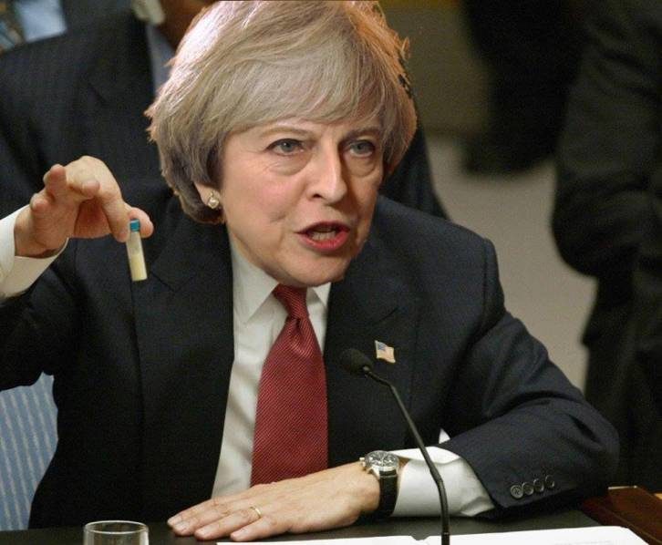 Theresa May with phial