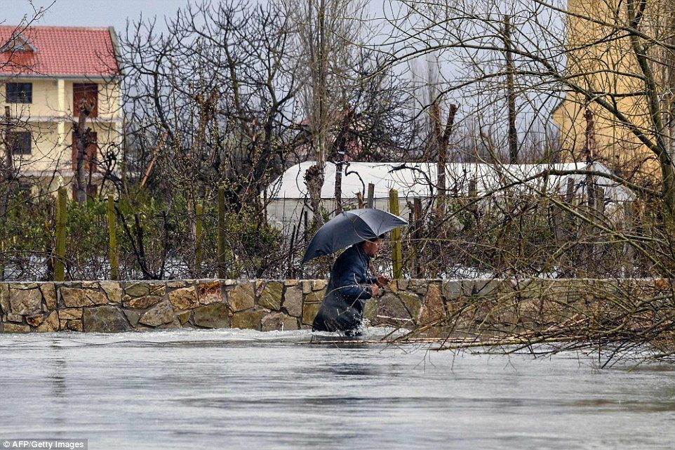Click to enlarge Around 800 people in the Albania village of Obot were left cut off from the rest of the country thanks to flooding that was also caused by melting snow
