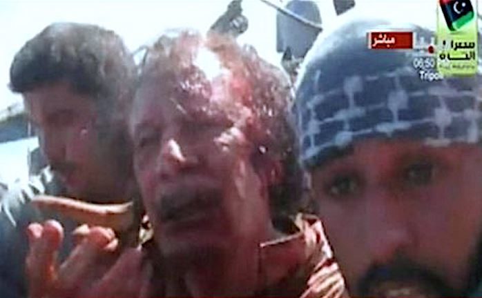 Click to enlarge Gaddafi bloody