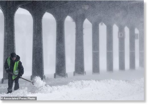Click to enlarge A municipal worker clears ice and snow from the platforms of the Gara de Nord, the main railway station in Bucharest, Romania, Friday, March 23, 2018.