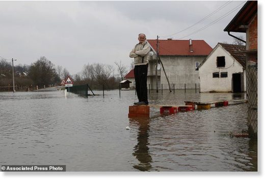 Click to enlarge Bosnian Milan Ilic watches the level of flooded water from the Sava River in front of his house in the village of Bistrica near Gradiska, 260 kms northwest of the Bosnian capital of Sarajevo, Thursday, March 22, 2018.